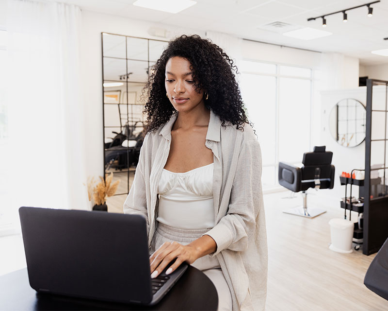 beauty educator on laptop