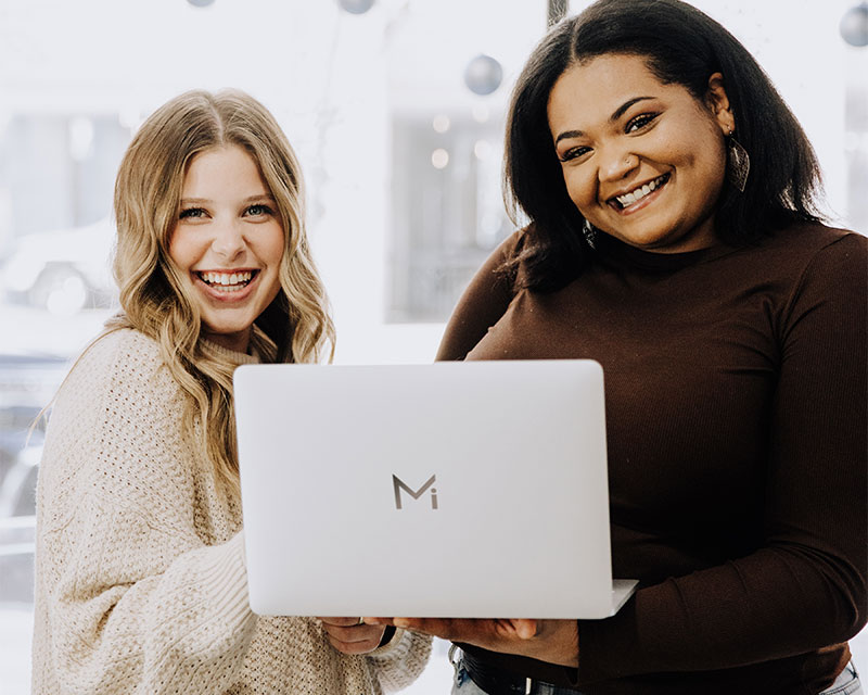 milady students on laptop